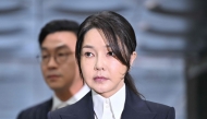 South Korea's former first lady Kim Keon Hee, wife of impeached former president Yoon Suk Yeol, arrives at a court to attend a hearing to review her arrest warrant requested by special prosecutors at the Seoul Central District Court in Seoul on August 12, 2025. (Photo by Jung Yeon-Je / Pool / AFP)