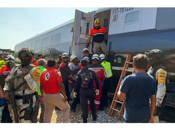 Mexican Army soldiers and Civil Protection members rescued passengers from the Interoceanic train that derailed in the Asuncion Ixtaltepec area on the route to Oaxaca, Mexico on December 28, 2025. (Photo by Rusvel Rasgado / AFP)