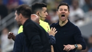 Real Madrid's Spanish coach Xabi Alonso shouts at Atletico Madrid's Argentine coach Diego Simeone during the Spanish Supercup semi-final football match between Atletico Madrid and Real Madrid at King Abdullah Sports City in Jeddah on January 8, 2026. (Photo by Fadel Senna / AFP)