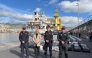 This undated handout photo released on January 12, 2026 by Spanish National Police shows Spanish police posing in front of some of the nearly 10 tons of cocaine seized on a cargo ship in Spain's Canary Islands. (Photo by Handout / Spanish National Police / AFP)