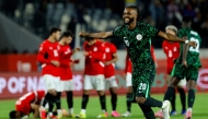 Nigeria's defender #20 Chidozie Awaziem celebrates after the penalty shoot out in the Africa Cup of Nations (CAN) third place football match between Egypt and Nigeria at the Mohammed V Stadium in Casablanca on January 17, 2026. (Photo by Abdel Majid BZIOUAT / AFP)