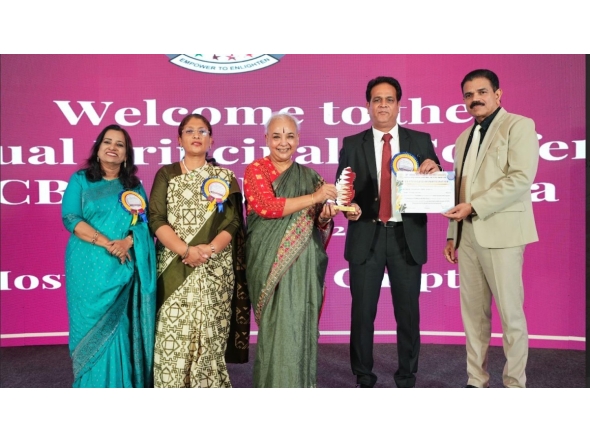 Acting Principal Mohammad Azam Khan receiving the award.