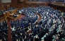 Lawmakers cheer as the House of Representatives is dissolved at the Diet in Tokyo on January 23, 2026. Photo by JIJI Press / AFP