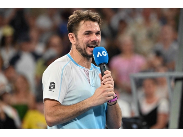 Switzerland's Stan Wawrinka gives an interview after losing to USA's Taylor Fritz in their men's singles match in Melbourne on January 24, 2026. (Photo by Paul Crock / AFP)