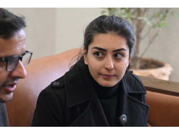 Human rights lawyer Imaan Mazari (R) sits with a journalist, after a hearing at the Islamabad High Court Bar Association in Islamabad on January 20, 2026. (Photo by Aamir Qureshi / AFP)