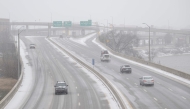 Vehicles are seen on the interstate as snowy weather arrives on January 24, 2026 in Louisville, Kentucky. Jon Cherry/Getty Images/AFP