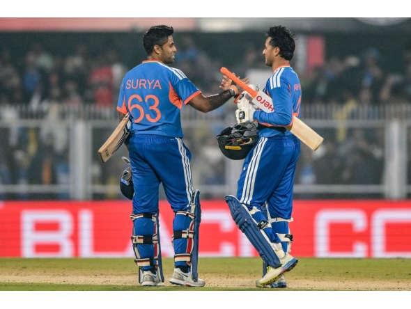 India's Abhishek Sharma and captain Suryakumar Yadav celebrate their team's win at the end of the third Twenty20 between India and New Zealand at Guwahati on January 25, 2026. (Photo by Biju BORO / AFP) 