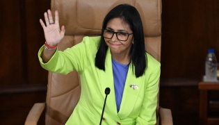 Venezuela's interim President Delcy Rodriguez waves during a presidential address to Parliament at the National Assembly in Caracas on January 15, 2026 (Photo by Federico PARRA / AFP)