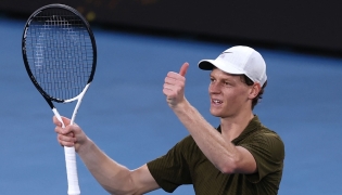 Italy's Jannik Sinner celebrates beating Italy's Luciano Darderi in their men's singles match on day nine of the Australian Open tennis tournament in Melbourne on January 26, 2026. (Photo by Izhar Khan / AFP)