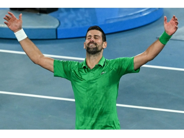 Serbia's Novak Djokovic celebrates victory over Italy's Jannik Sinner after their men's singles semi-final match on day thirteen of the Australian Open tennis tournament in Melbourne on January 31, 2026. (Photo by William West / AFP)