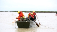 Civil defence rescuers ride in a boat on flood waters in the Sidi Kacem region, in northwestern morocco on February 5, 2026. (Photo by AFP)
