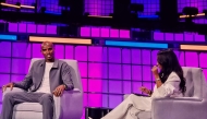 British athletics legend Sir Mo Farah with Al Jazeera’s Samantha Johnson during a session at the Web Summit Qatar 2026.