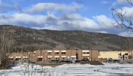 This screengrab of a video provided by local journalist Trent Ernst shows the middle school and high school building where a shooting took place, leaving at least nine people dead in the small town of Tumbler Ridge, British Columbia, on February 10, 2026. (Photo by Trent Ernst / AFP)