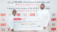 Head of Banking Products at QIIB, Talal Al-Jaidah presenting the award to Mohammad Abdulrahman A Al-Abdulla.