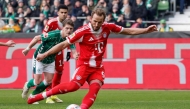 Bayern Munich's English forward #09 Harry Kane scores the opening goal from the penalty spot during the German first division Bundesliga football match between SV Werder Bremen and FC Bayern Munich in Bremen, northern Germany, February 14, 2026. (Photo by Focke Strangmann / AFP)