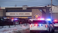 Police stand outside the perimeter they created around the Dennis M. Lynch Arena where a shooting occurred earlier today in Pawtucket, Rhode Island, on February 16, 2026. Photo by Joseph Prezioso / AFP