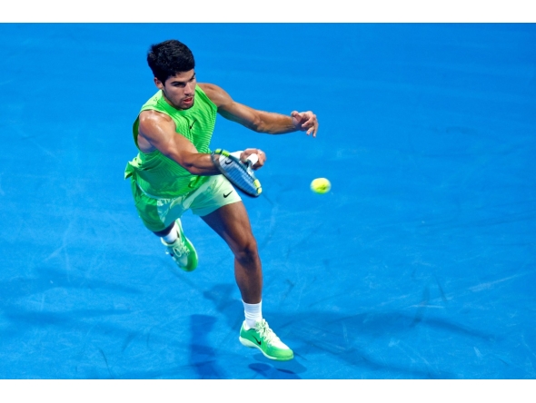Spain’s Carlos Alcaraz hits a return against France’s Valentin Royer. PICS: AFP