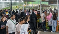 People visiting the exhibition at Katara. 