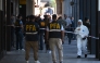 First responders work at the entrance of the Superior Gendarmerie School in Buenos Aires on February 20, 2026, after a mail package exploded. Three people were injured on February 20 by the explosion of a mail package at the Superior Gendarmerie School in Buenos Aires. (Photo by Luis Robayo / AFP)