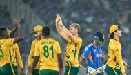 India’s captain Suryakumar Yadav (second right) walks off the field as South Africa’s players celebrate his dismissal.