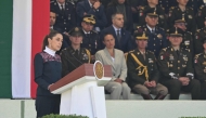 Mexico's President Claudia Sheinbaum delivers a speech during the celebration of Flag Day in Mexico City on February 24, 2026. (Photo by YURI CORTEZ / AFP)