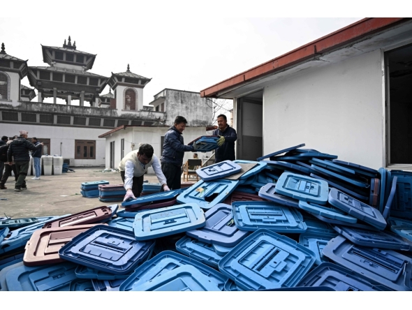 (Files) Election officials inspect ballot boxes before they are dispatched from the Election Commission office in Kathmandu on February 9, 2026 ahead of Nepal's general elections. (Photo by Prakash MATHEMA / AFP)