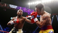 Floyd Mayweather (left) exchange punches with Manny Pacquiao during their welterweight unification championship bout in Las Vegas, Nevada in this in this May 2, 2015 file photo.