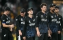 New Zealand's captain Mitchell Santner (3R) walks off the ground with his teammates following their win at the R Premadasa Stadium in Colombo on February 25, 2026. (Photo by Dibyangshu Sarkar / AFP)