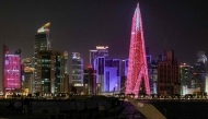 High-rise buildings are pictured at night along the Corniche in Doha on March 1, 2026. (Photo by Karim Jaafar / AFP)