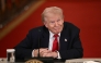 US President Donald Trump listens during a roundtable in the East Room of the White House in Washington, DC, on March 6, 2026. (Photo by Brendan Smialowski / AFP)