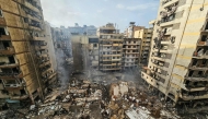  A photograph shows the site of an overnight Israeli airstrike that targeted the Haret Hreik neighbourhood of Beirut's southern suburbs on March 14, 2026.