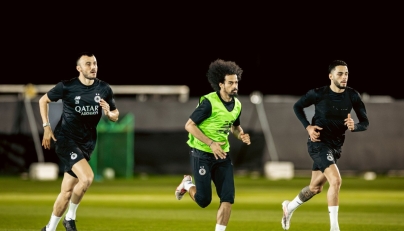 Al Sadd's Akram Afif (centre) trains with teammates.