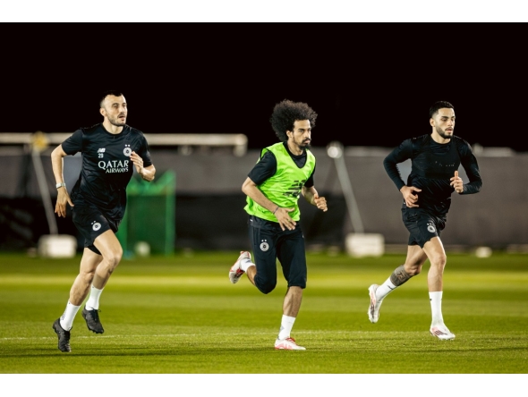 Al Sadd's Akram Afif (centre) trains with teammates.