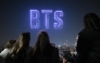 Drones illuminate the night sky with BTS logo during a drone light show at a riverside park in Seoul on March 20, 2026, ahead of the comeback concert of K-pop boy band BTS. Photo by Jung Yeon-je / AFP