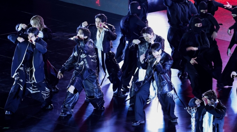 K-pop boy group BTS perform during their concert at Gwanghwamun Square in Seoul on March 21, 2026. (Photo by Kim Hong-Ji / POOL / AFP)