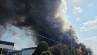Heavy smoke rise following a fire at a car parts plant in Daejeon A fire at a car parts plant in South Korea on March 20 seriously injured at least 21 people and left 14 others missing, authorities said. (Photo by YONHAP / AFP)