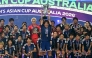 Japan's Hana Takahashi holds the trophy aloft after winning the final of the AFC Women痴 Asian Cup Australia 2026 football tournament between Australia and Japan at Stadium Australia in Sydney on March 21, 2026. (Photo by Saeed Khan / AFP)