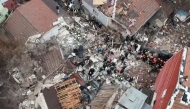Screengrab of the wreckage of the collapsed buildings as viewed from the air ( NTV)