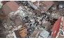 Screengrab of the wreckage of the collapsed buildings as viewed from the air ( NTV)