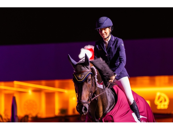 Cyrine Cherif celebrates astride Triple T Calamando Blue.