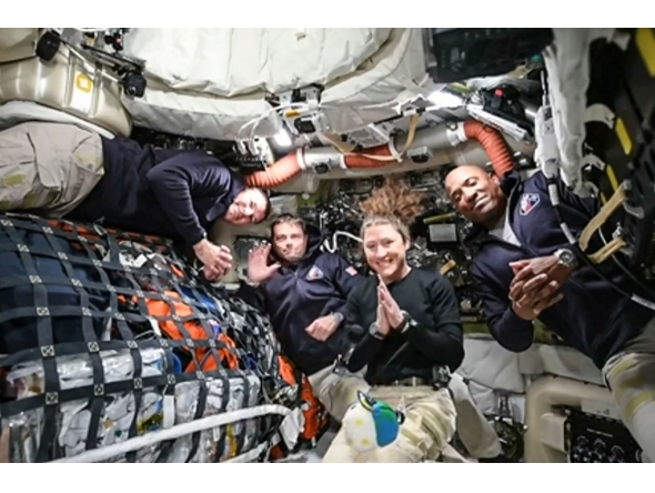 This screen grab from NASA's feed released on April 3, 2026, shows the four Artemis II crew members (L-R) Canadian Space Agency (CSA) astronaut Jeremy Hansen, Artemis II mission specialist, NASA astronauts Reid Wiseman, Artemis II commander, Christina Koch, Artemis II mission specialist and Victor Glover, Artemis II pilot. (Photo by Handout / NASA TV / AFP)