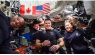 This screengrab taken from a NASA livestream shows Artemis II mission astronauts (L-R) NASA's pilot Victor Glover, NASA commander Reid Wiseman, Canadian Space Agency's mission specialist Jeremy Hansen and NASA's mission specialist Christina Koch as they attend a 