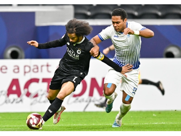 Al Sadd's Akram Afif (left) controls the ball