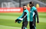 Liverpool's Egyptian striker #11 Mohamed Salah and Liverpool's Hungarian midfielder #08 Dominik Szoboszlai (R) attend a team training session at their training ground in Kirkby, Liverpool, north-west England on April 13, 2026, on the eve of their UEFA Champions League, quarter final second leg football match against Paris Saint-Germain. (Photo by PETER POWELL / AFP)