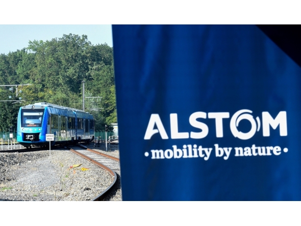 FILE PHOTO: This photograph taken on September 6, 2021 shows Alstom's logo and Alstom's Coradia iLint train, the first in the world to be powered by hydrogen, during its inauguration on the tracks of the Railway Test Center in Petite-Foret, northern France taken on September 6, 2021 . (Photo by Francois Lo Presti/ AFP)
