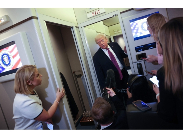 US President Donald Trump speaks to members of the press aboard Air Force One on April 17, 2026 just prior to landing at Joint Base Andrews, Maryland. Win McNamee/Getty Images/AFP