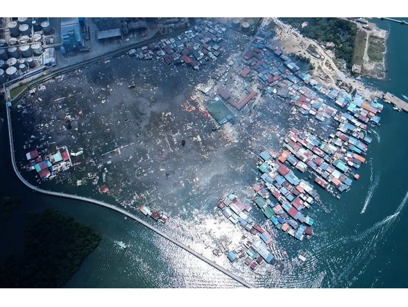 This handout photo taken and released by Malaysia Sandakan Fire and Rescue Department on April 19, 2026, shows a general view of the Kampung Bahagia water village after a fire, in Sandakan, on Malaysia Borneo island. (Photo by Handout / Malaysia Sandakan Fire and Rescue Department / AFP)
