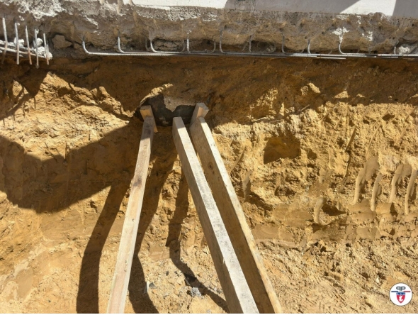 This undated handout photograph made available by the Precture de Police on April 19, 2026 shows a bomb from World War II partially uncovered near a residential area, prompting a vast operation by emergency services to neutralise the device, in Paris' northwestern suburb of Colombes. Photo by Handout / Préfecture de police / AFP