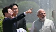 South Korea's President Lee Jae Myung (L) gestures alongside India's Prime Minister Narendra Modi (R) as they plant a tree during a meeting at the Hyderabad House in New Delhi on April 20, 2026. (Photo by Sajjad HUSSAIN / AFP)