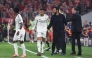 Real Madrid's Spanish coach Alvaro Arbeloa (2nd R) and Real Madrid's French forward #10 Kylian Mbappe (2nd L) are seen on the sidelines during the UEFA Champions League quarter-final second leg football match between FC Bayern Munich and Real Madrid in Munich, southern Germany, on April 15, 2026. (Photo by Karl-Josef HILDENBRAND / AFP)